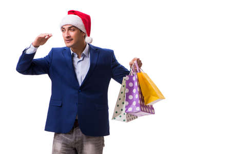 Young man with bags after christmas shopping on white backgroundの写真素材