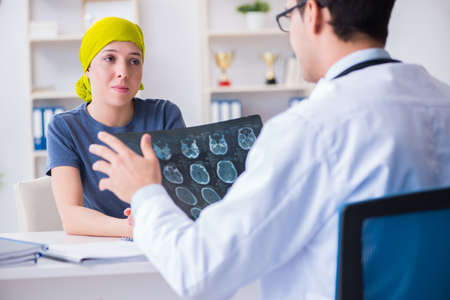 Cancer patient visiting doctor for medical consultation in cliniの写真素材