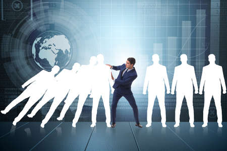 Businessman in domino effect business conceptの写真素材