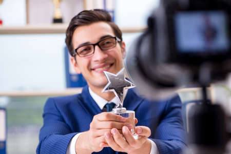 Businessman recording a video for vlogの写真素材