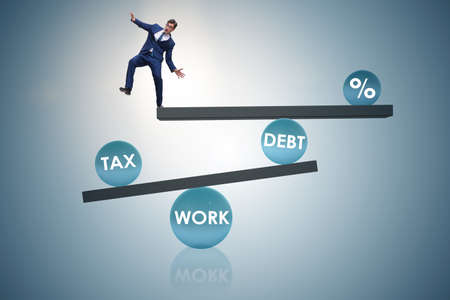Businessman in debt and tax business conceptの写真素材