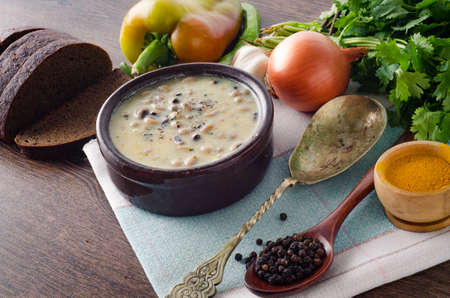 Mushroom soup served on the tableの写真素材