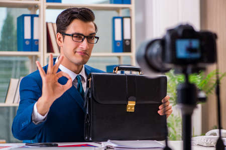 Businessman recording a video for vlogの写真素材