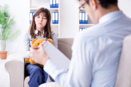 Patient visiting psychiatrist doctor for examinationの写真素材