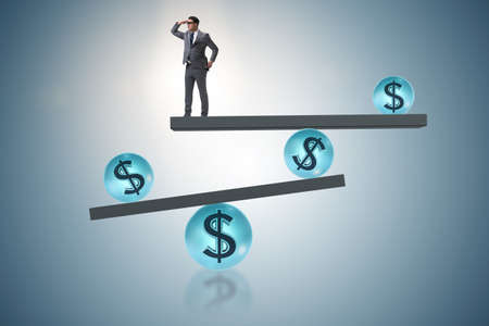 Businessman balancing in financial dollar conceptの写真素材