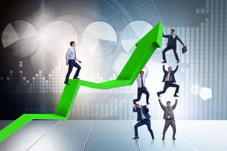 Businessman supporting growtn in economy on chart graphの写真素材