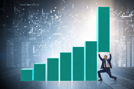 Businessman supporting growtn in economy on chart graphの写真素材