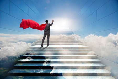 Businessman superhero successful in career ladder conceptの写真素材