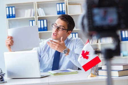 Blogger doing webcast on canadian immigration to Canadaの写真素材