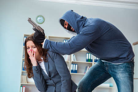 Criminal taking businesswoman as hostage in office