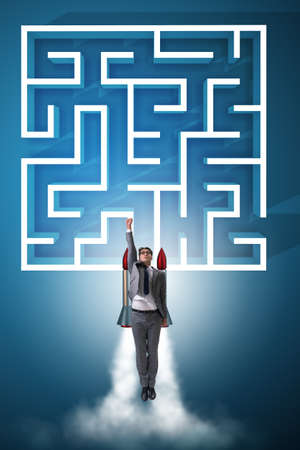 Uncertainty concept with businessman lost in maze labyrinthの写真素材