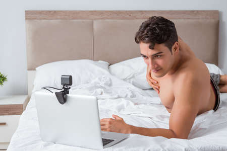 Young sexy man in online dating conceptの写真素材