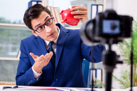 Businessman recording a video for vlogの写真素材