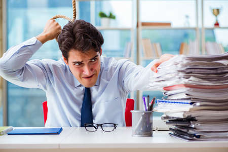 Concept of overworked businessman with noose around his neckの写真素材