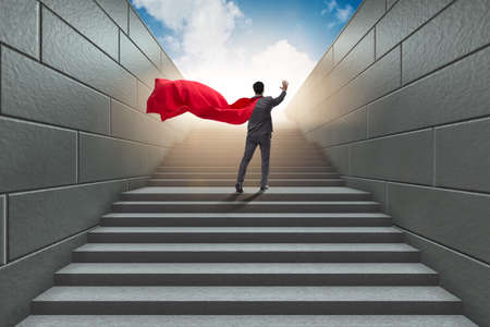Businessman superhero successful in career ladder conceptの写真素材