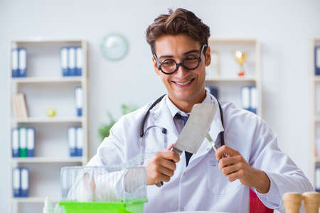 Mad crazy doctor preparing to eat rabbitの写真素材