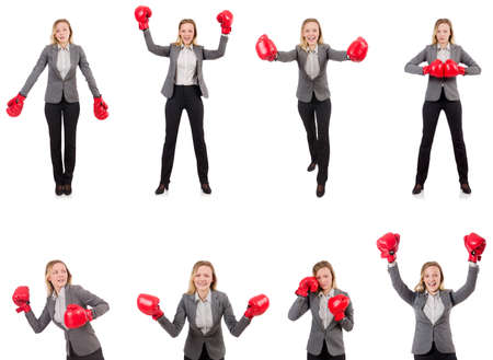 Woman businesswoman with boxing gloves on white backgroundの写真素材