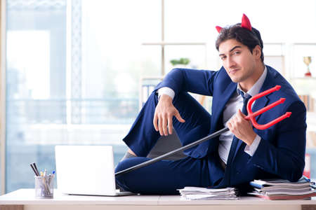 Devil angry businessman in the office