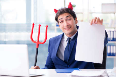 Devil angry businessman in the officeの写真素材