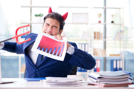 Devil angry businessman in the officeの写真素材