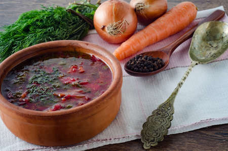 Bowl of traditional soup Borscht on table