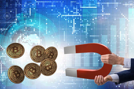 Businessman mining bitcoins with horseshoe magnet
