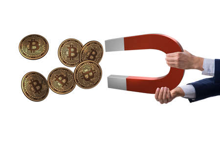 Businessman mining bitcoins with horseshoe magnet