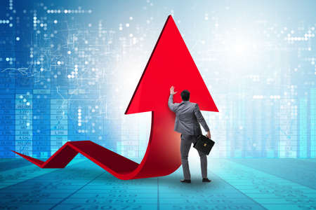 Businessman supporting growtn in economy on chart graph
