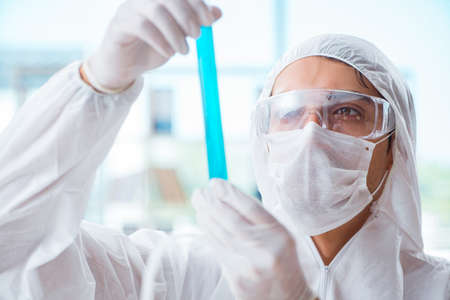 Chemist working in the laboratory with hazardous chemicalsの写真素材