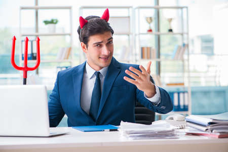 Devil angry businessman in the office