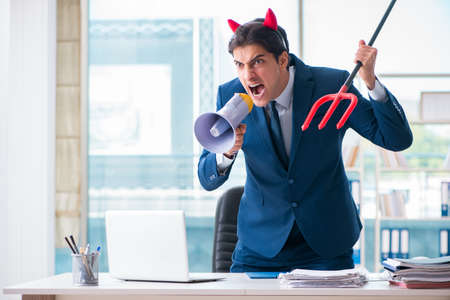 Devil angry businessman in the office