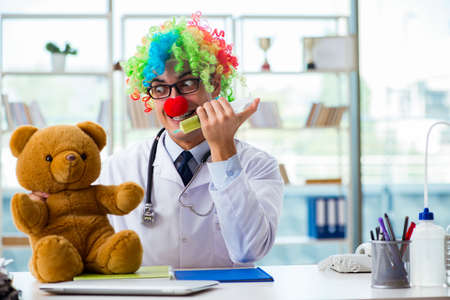 Funny pediatrician with toy in the hospital clinicの写真素材