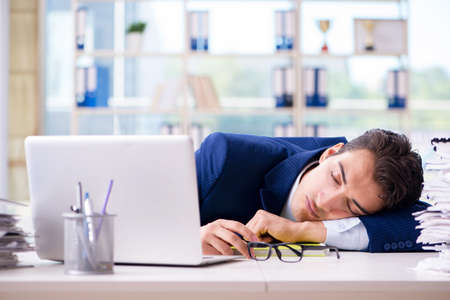 Tired businessman exhausted after hard work and excessive worklo