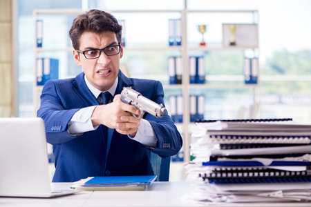 Stressed businessman thinking of suicide due to excessive workloadの写真素材