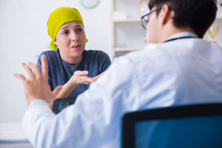 Cancer patient visiting doctor for medical consultation in clinicの写真素材