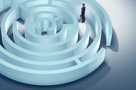 Businessman is trying to escape from maze labyrinthの写真素材