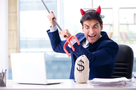 Devil angry businessman in the officeの写真素材
