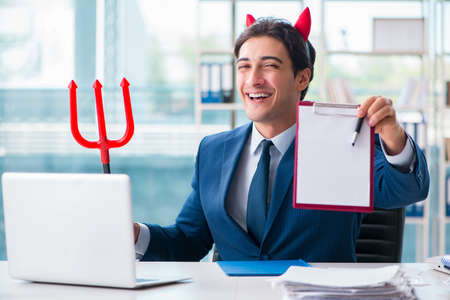 Devil angry businessman in the office