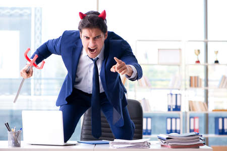 Devil angry businessman in the officeの写真素材