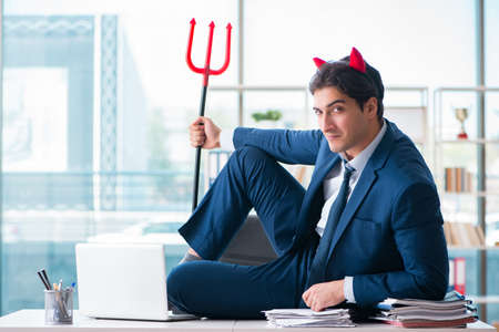 Devil angry businessman in the officeの写真素材