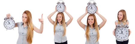 Young woman with clock on whiteの写真素材