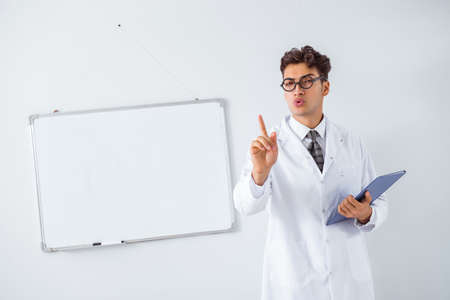 Funny doctor scientist making presentation in hospitalの写真素材