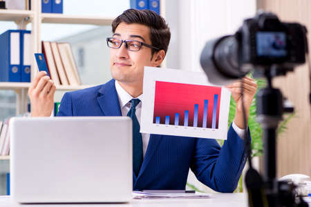 Businessman recording a video for vlogの写真素材