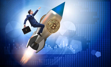 Businessman flying on rocket in bitcoin price rising conceptの写真素材