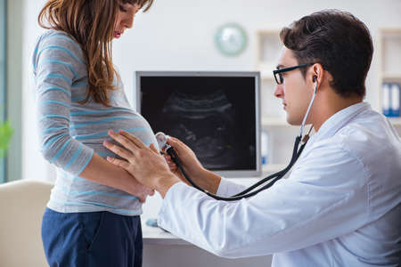 Pregnant woman visiting doctor for regular check-upの写真素材