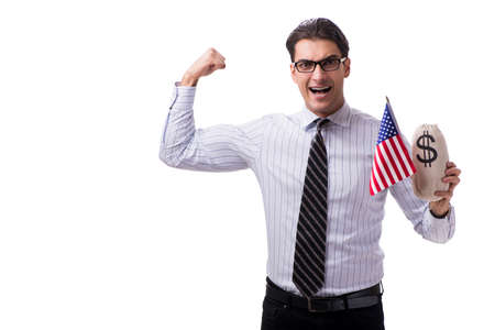 Young businessman with american flag and money sack on whiteの写真素材