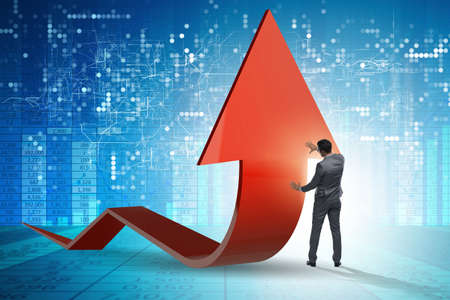 Businessman supporting growtn in economy on chart graph
