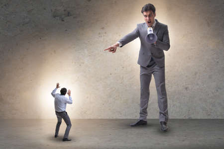 Bad angry boss shouting at employee with loudspeaker