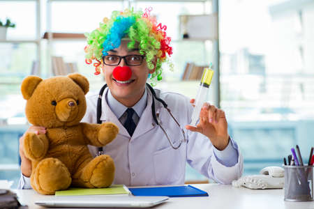 Funny pediatrician with toy in the hospital clinicの写真素材