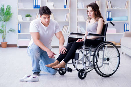 Patient undergoing rehabilitation recovery programme with doctorの写真素材